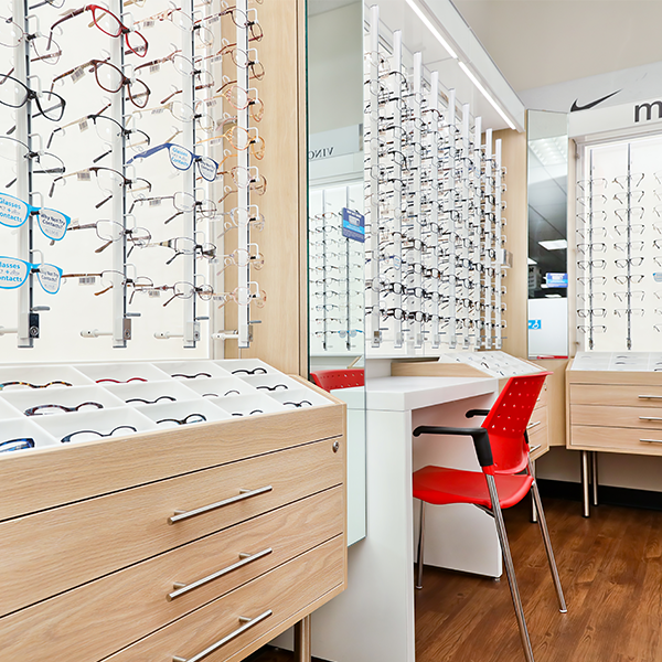 Custom Optical Displays CVS Store Design - Custom Optical Display - Wall Glasses Display with built in Desk and Storage