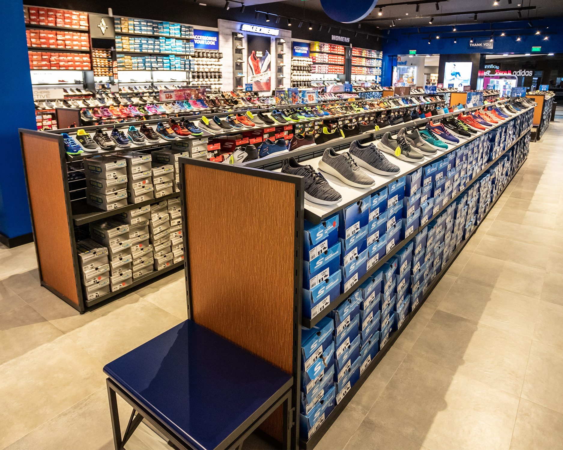 Custom Retail Furniture Skechers Store Design - Shoe Racks and Endcap Bench