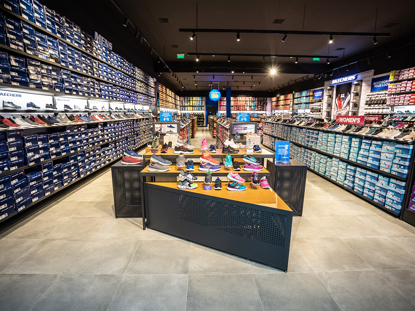 Front view of the Skechers store highlighting the shoe display table